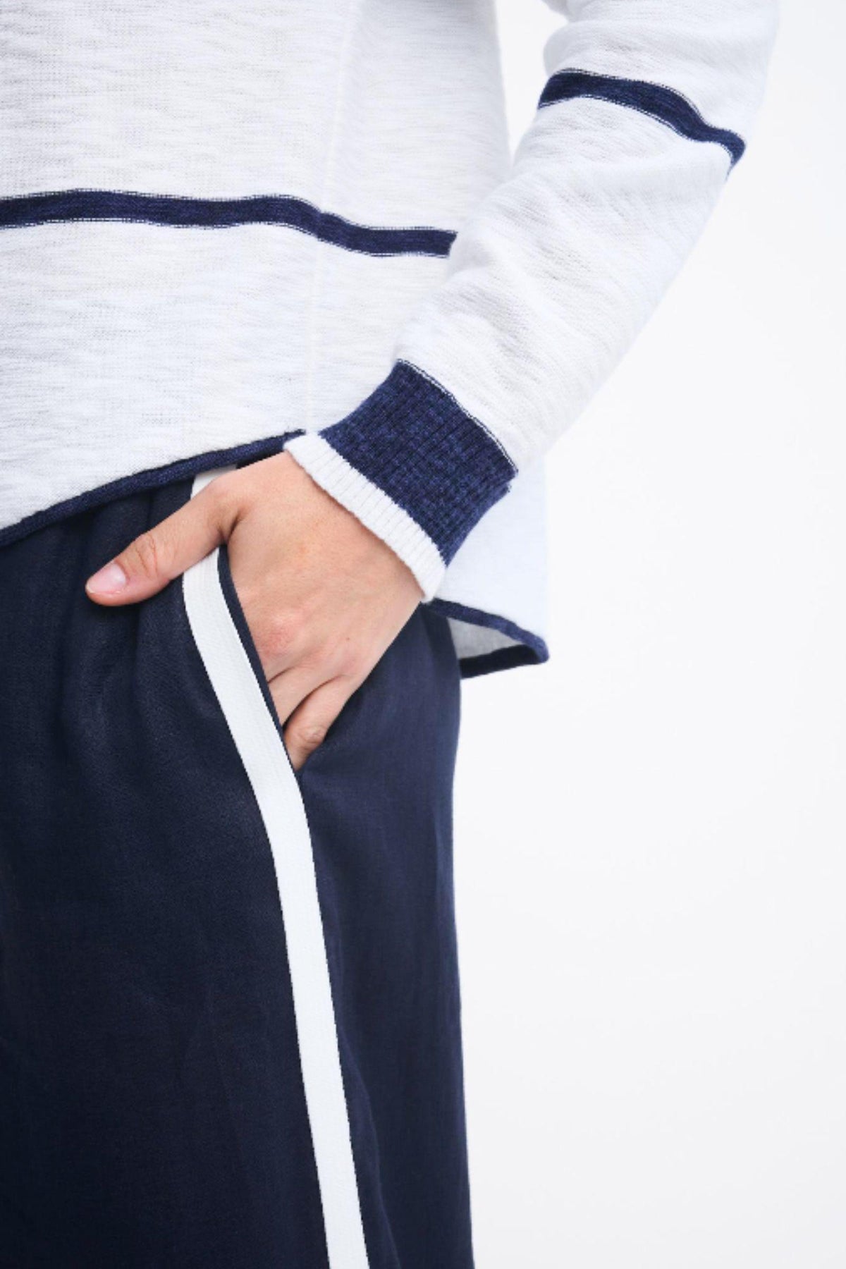 Kaia Top and Monaco Pants by Little Lies — close-up detail of the white and navy striped Kaia Top with navy sleeve cuff, styled with navy Monaco Pants featuring white side stripes, available in Australia at Kat and Ko Clothing.