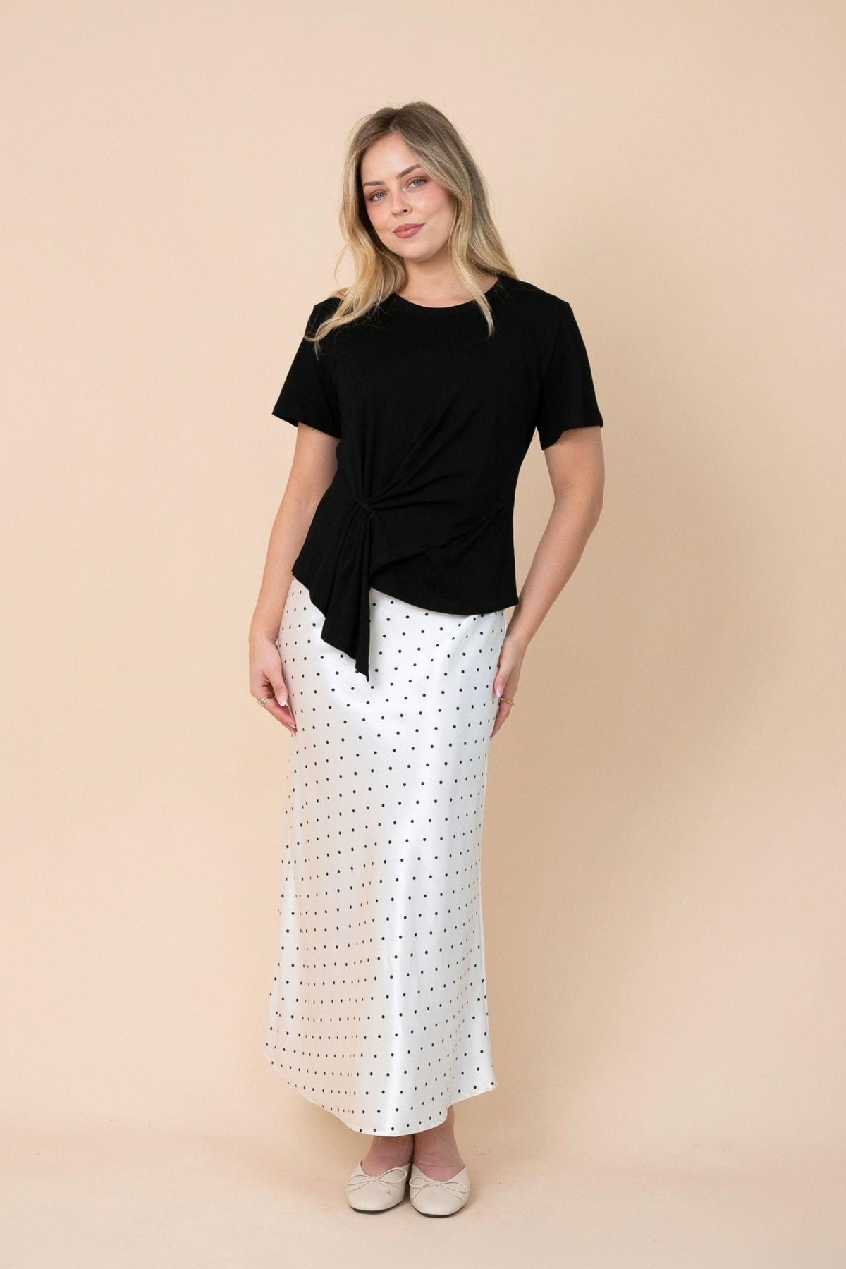 Fria The Label Ellery Tee — black cotton top showing its modern asymmetrical hem, product view, available in Australia at Kat and Ko Clothing