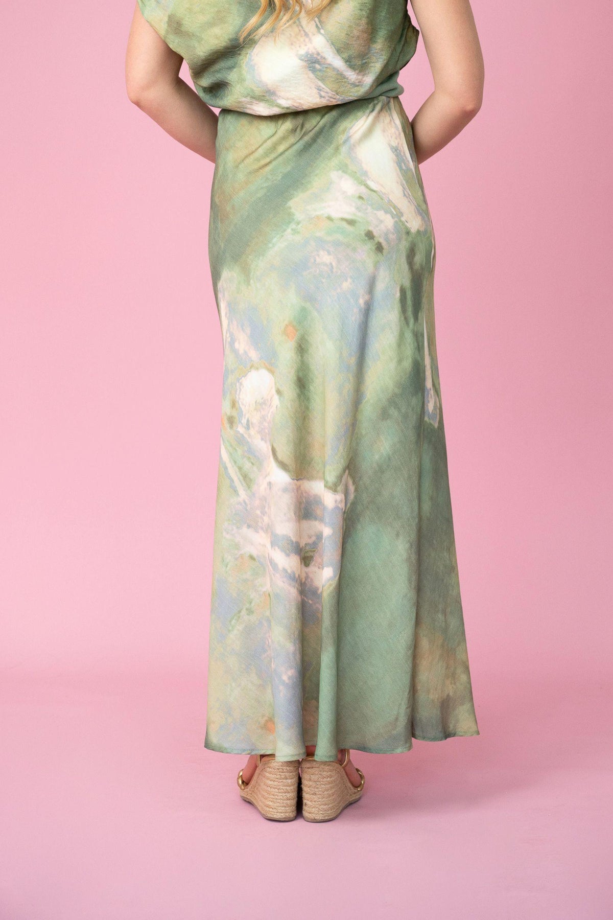 Fria The Label Dune Print Maxi Skirt in Sage back view with tan sandals