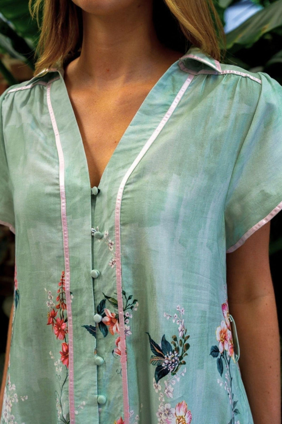 Sanders Dress by Boho Australia — close-up of the sage floral dress showing the collar neckline, front placket, piping trim and tulip sleeve, available in Australia at Kat and Ko Clothing
