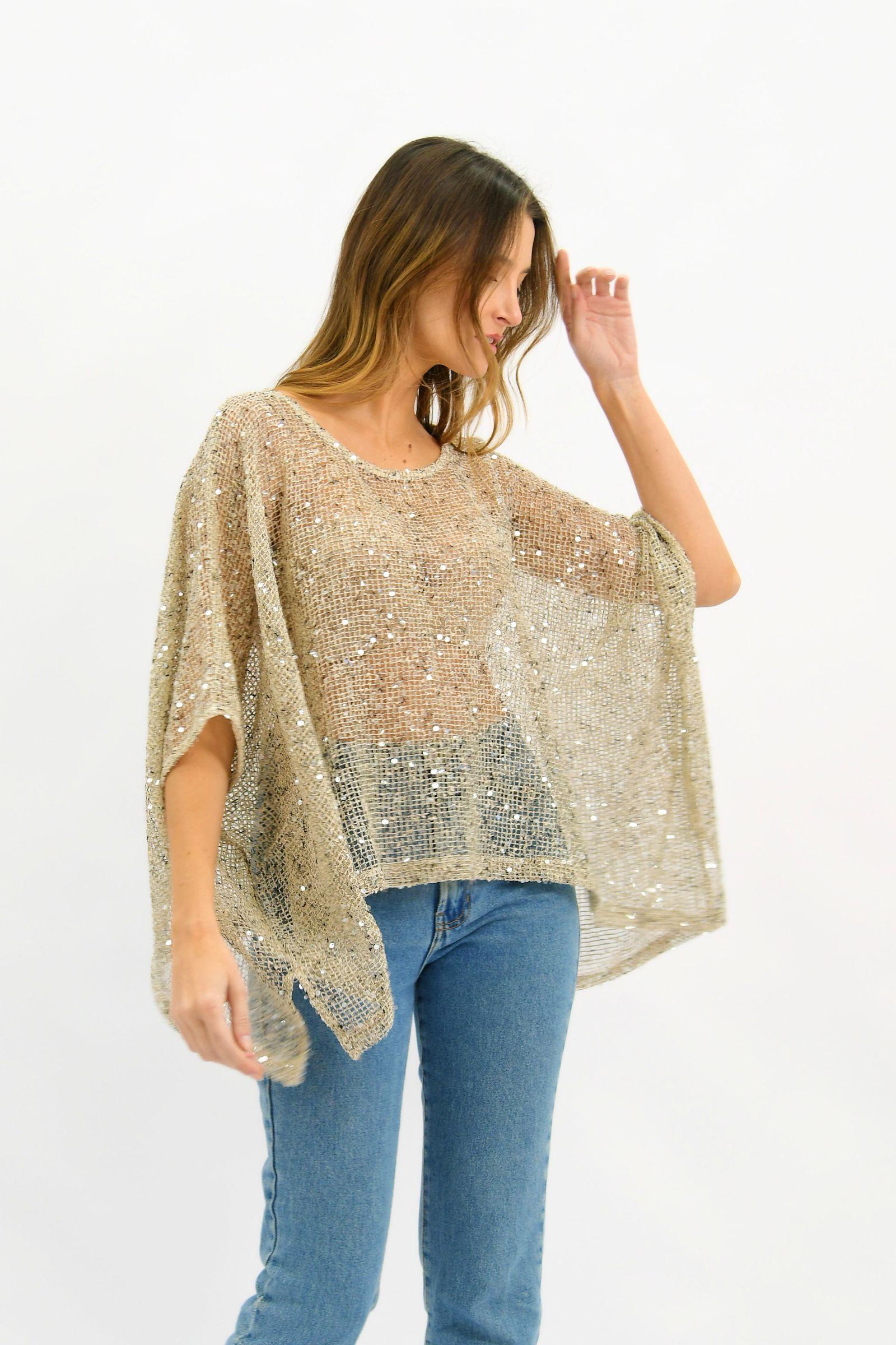 Golden Hour Sequin Top Beige Worthier — angled side view showing the draped batwing sleeves and all-over champagne sequin mesh, styled with blue denim jeans and gold hoop earrings, shop in Australia at Kat and Ko Clothing