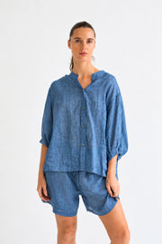 Worthier Aurora Linen Top in Denim Blue with button front and balloon sleeves, worn with matching Eden shorts