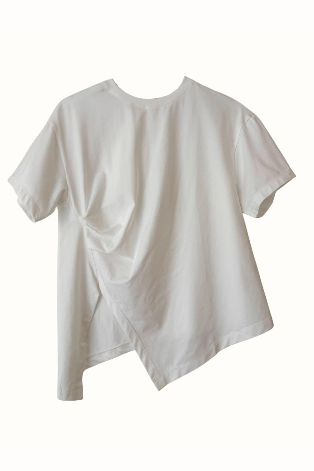 Little Lies Ruched Jersey Tee — white short-sleeve jersey tee with ruched side detailing and a draped hem shown on a plain background, available in Australia at Kat and Ko Clothing.