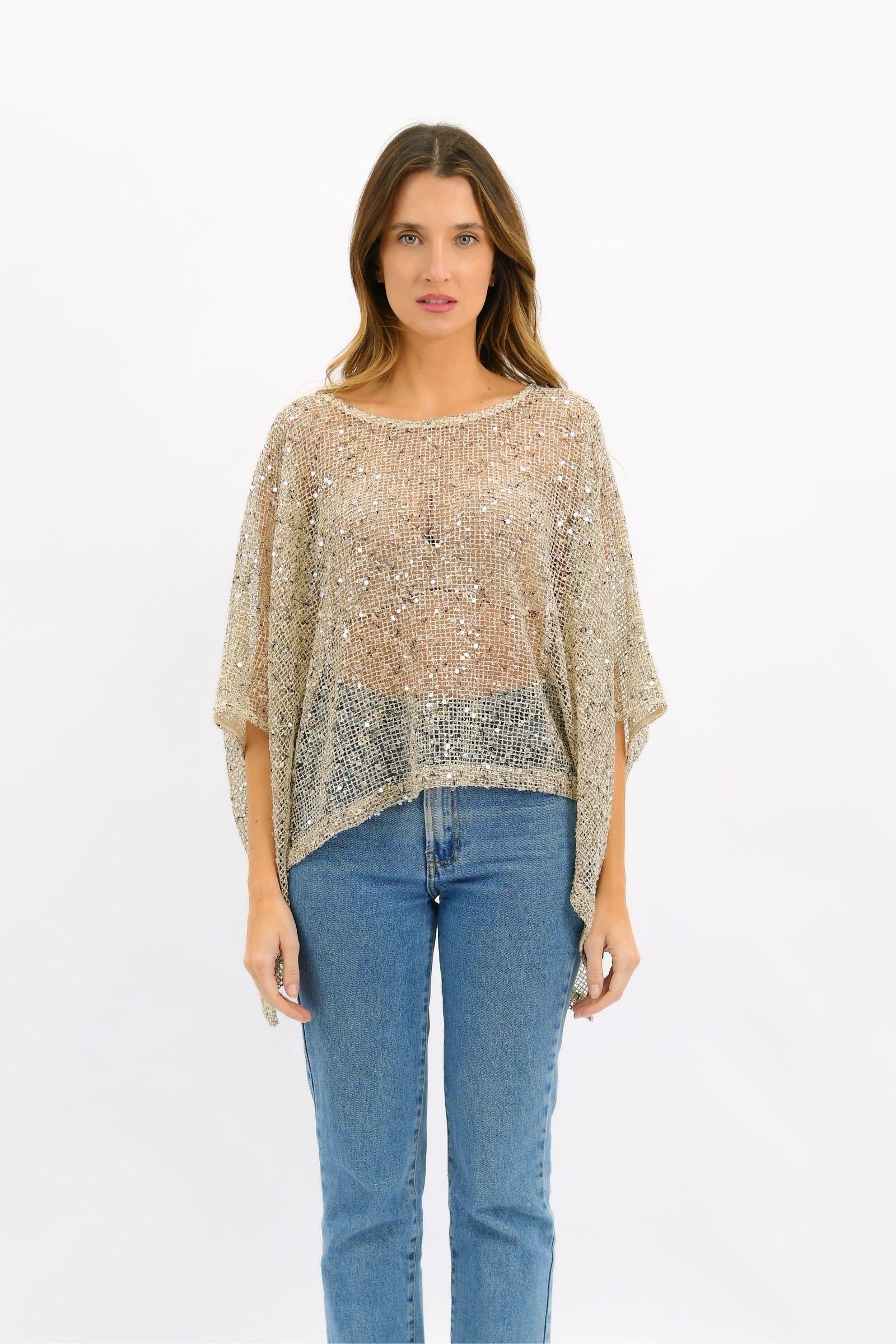 Worthier Golden Hour Sequin Top Beige — full-length front view of all-over sequin mesh oversized poncho in champagne beige with wide batwing silhouette, styled with blue straight-leg jeans, available in Australia at Kat and Ko Clothing