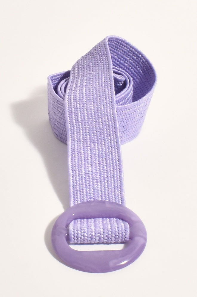 A lilac-colored resin stretch summer belt with a circular buckle.