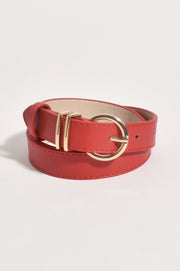 A red leather belt with a gold-colored buckle.