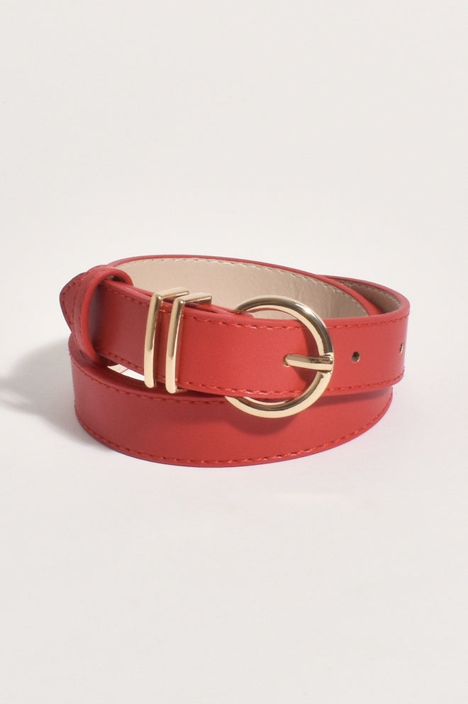A red leather belt with a gold-colored buckle.