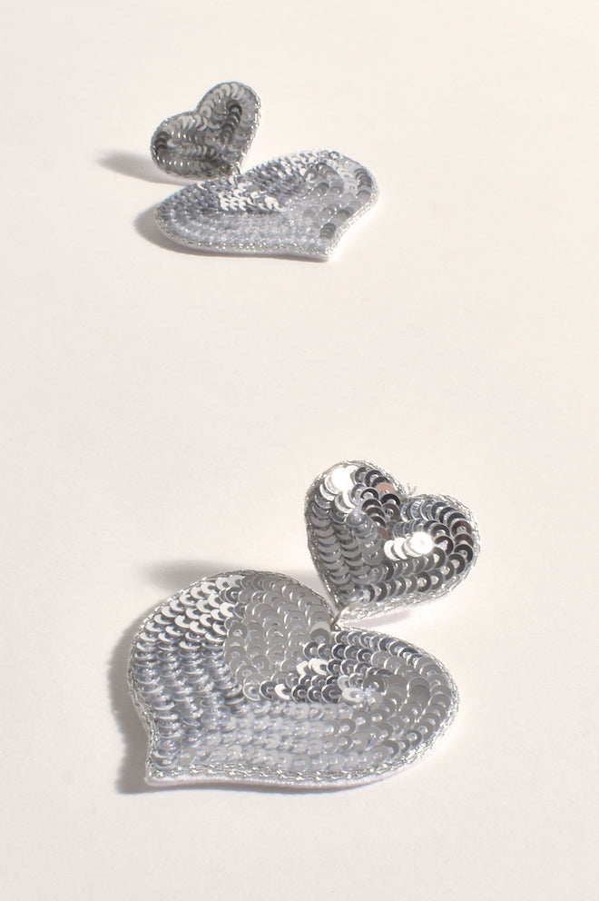 Adorne Double Heart Stud Earrings Silver — close-up of silver double heart stud earrings