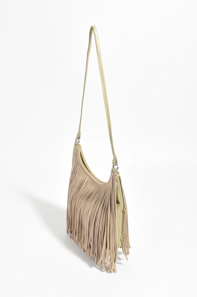 Beige fringe handbag on a white background