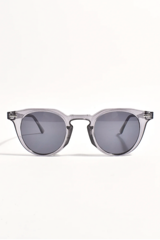 Clear frame sunglasses with dark lenses on a white background