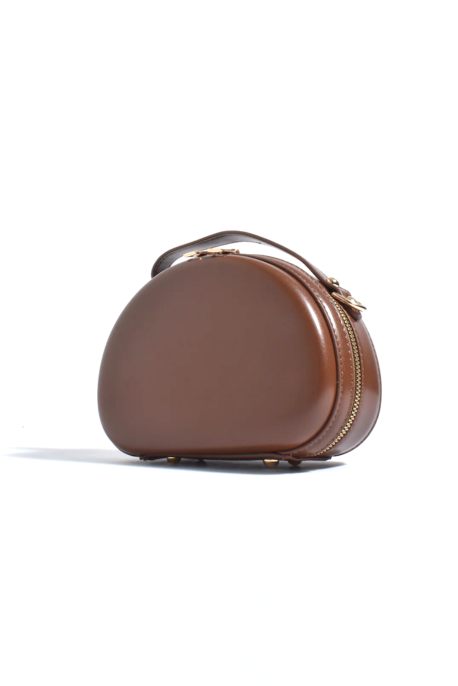 Brown cosmetic case with gold zipper on a white background