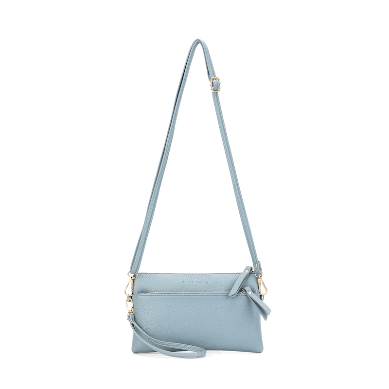 Light blue handbag with a strap on a white background