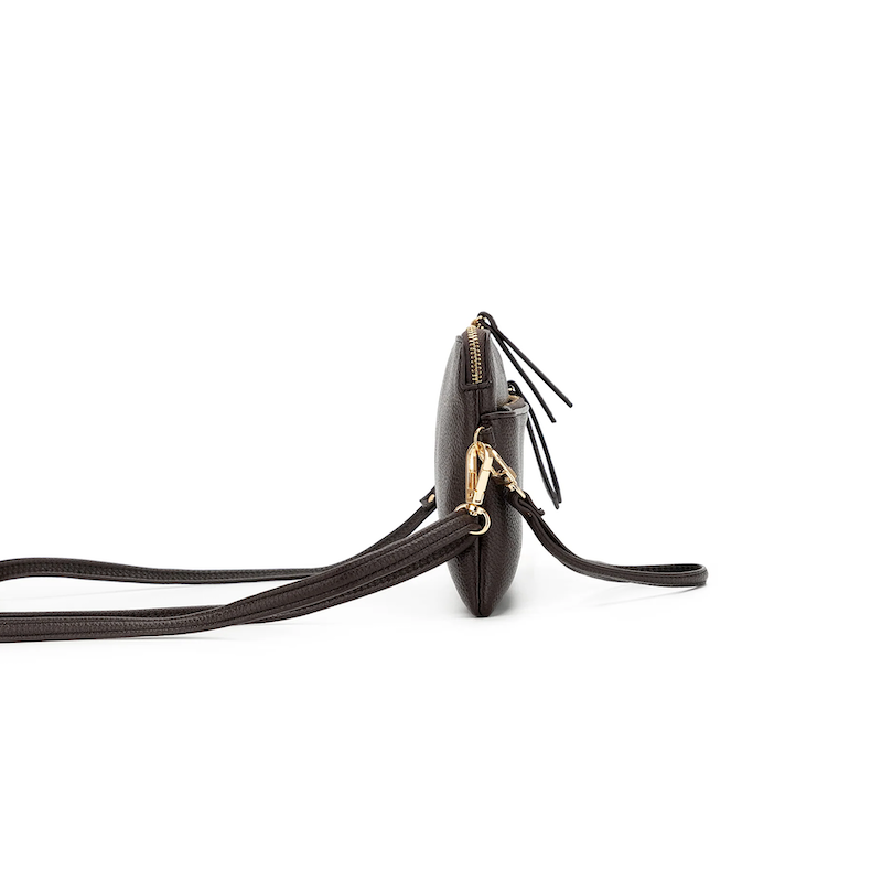 Black handbag with a long strap on a white background