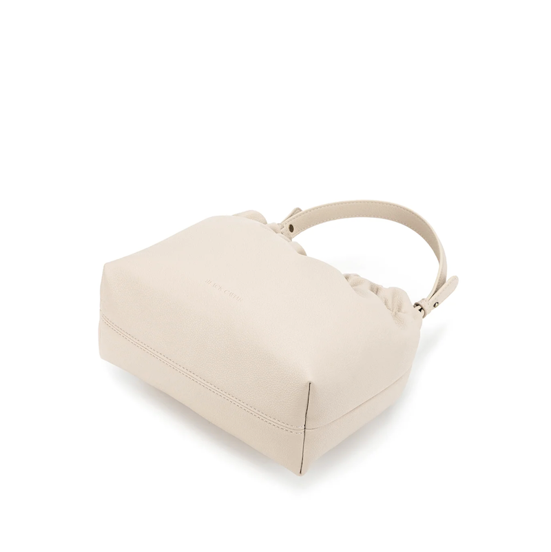 Beige handbag on a white background