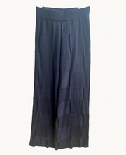 A pair of black knit pants displayed against a white background.