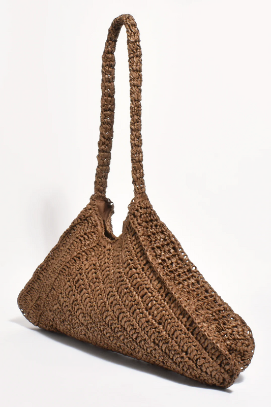 Brown woven handbag on a white background