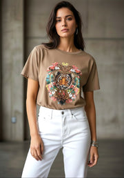 Kat and Ko Clothing Donatella chocolate brown t-shirt with a sparkling tiger graphic worn with white jeans.