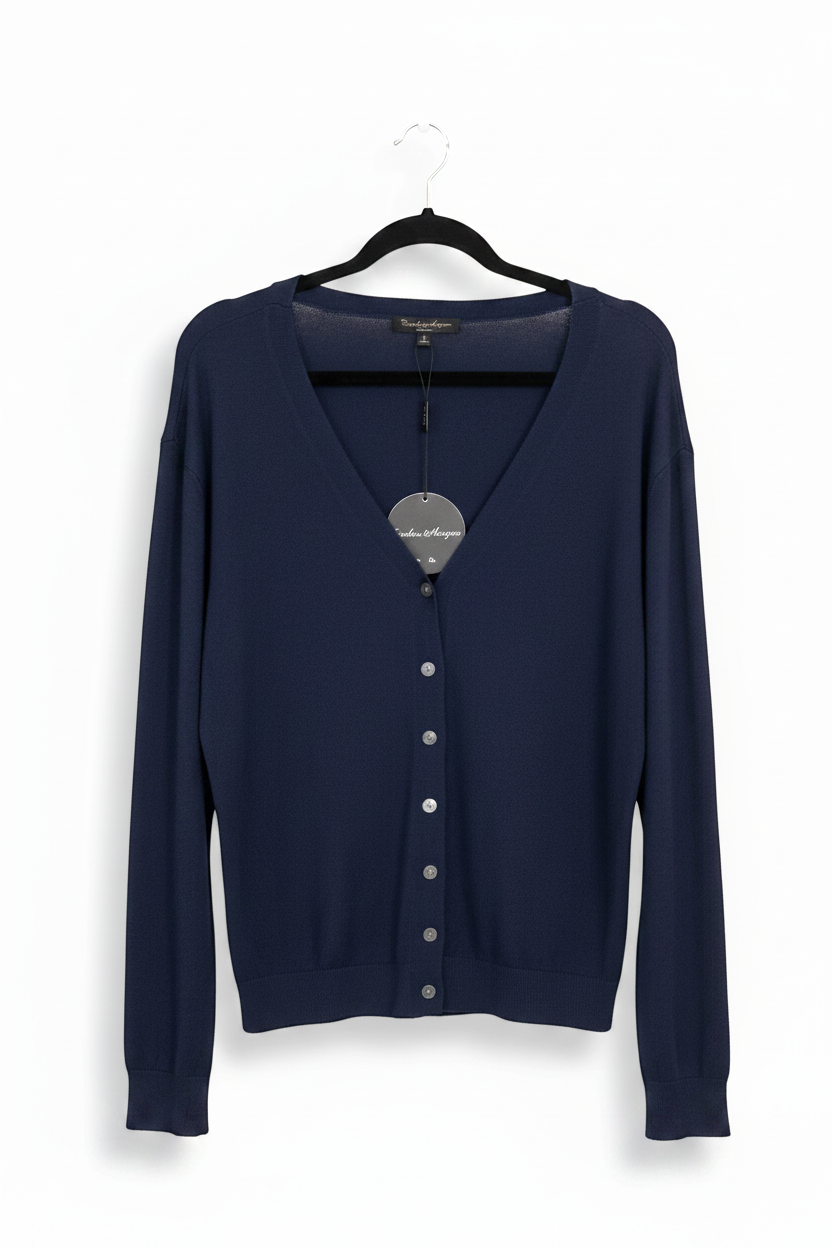 Kat and Ko Clothing Caroline Cardi in navy blue with a V-neckline and button-down front on a black hanger
