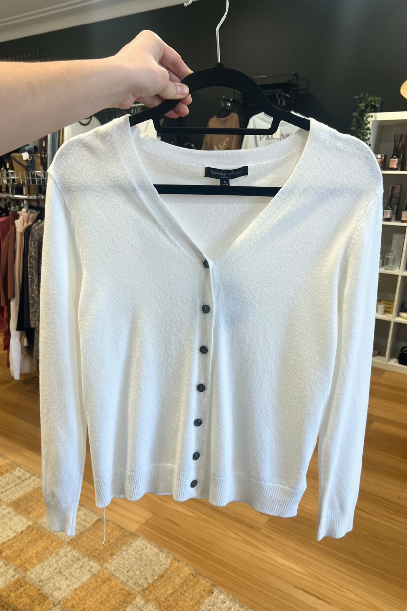 Kat and Ko Clothing white Caroline Cardi button-up cardigan with a V-neckline and long sleeves.