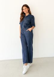 Collette Chambray Pant by Label of Love — full-length front view of dark blue lyocell wide-leg pants with drawstring waist, styled as co-ord with matching Collette Shirt and white sneakers, available in Australia at Kat and Ko Clothing