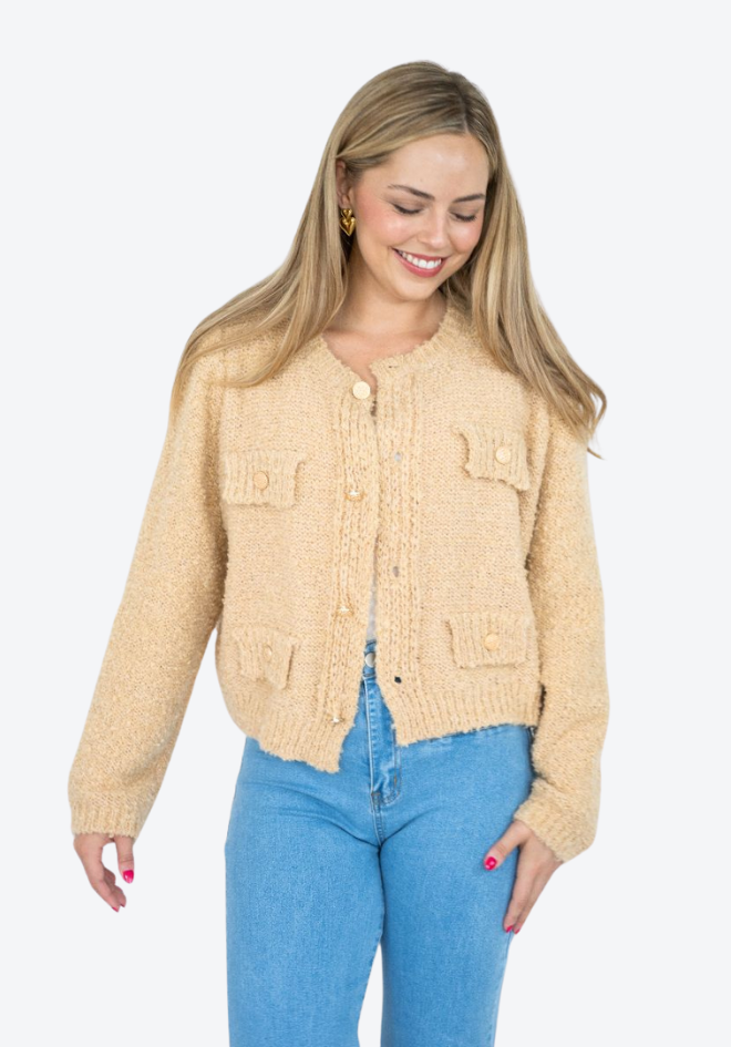 Fria The Label Audrey Cardi Latte — close-up front view of latte boucle knit cardi showing gold button closure, patch pockets and tassel trim, styled with blue jeans, shop in Australia at Kat and Ko Clothing
