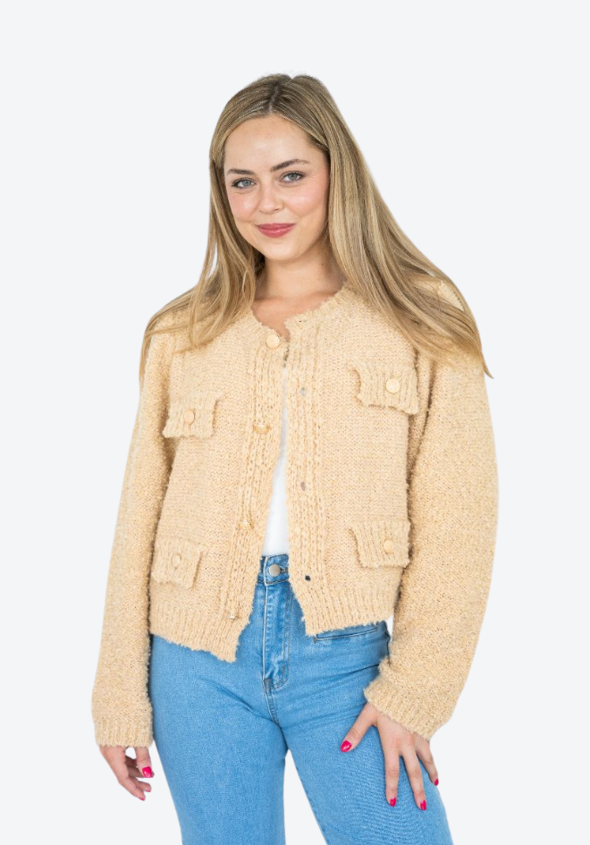 Audrey Cardi in Latte by Fria The Label — front view of latte boucle knit cardigan worn open with gold buttons and tassel detail, styled with blue jeans, available in Australia at Kat and Ko Clothing