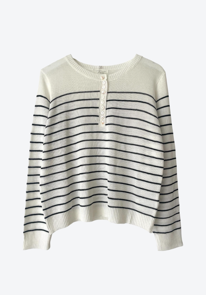 Striped sweater with black and white stripes on a white background