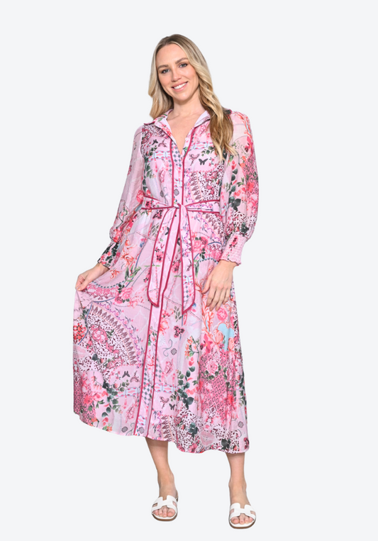 Woman wearing a pink floral dress on a white background