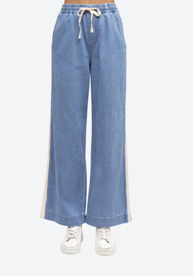 Light blue wide-leg jeans with a drawstring waist on a white background