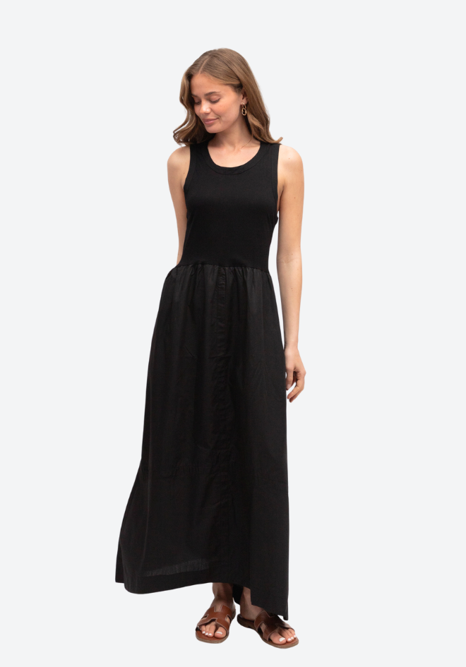 Woman wearing a black sleeveless dress on a white background