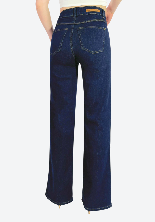 Blue jeans worn by a person on a white background