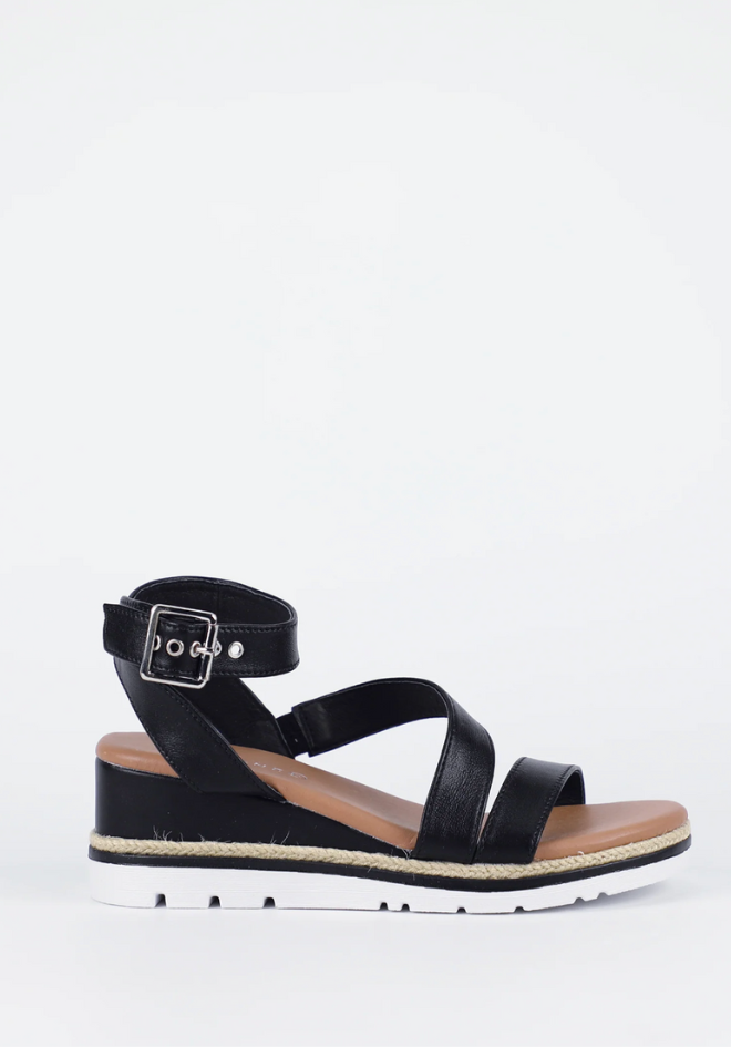 Black sandal with a strap on a white background