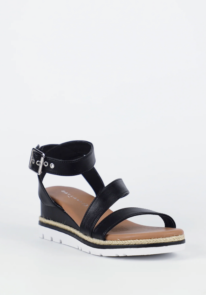 Black sandal with a strap on a white background