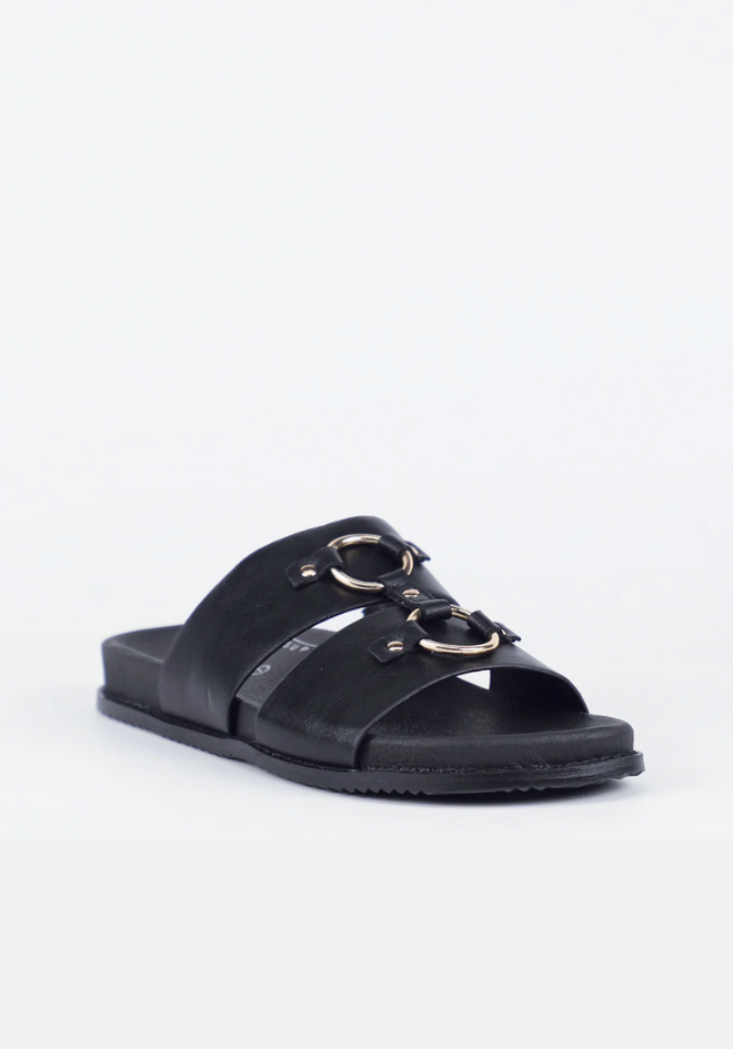 Black sandal with gold accents on a white background