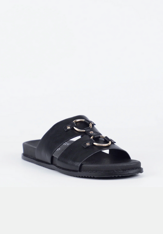 Black sandal with gold accents on a white background