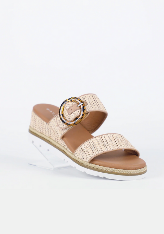 Woven sandal with a circular strap on a white background