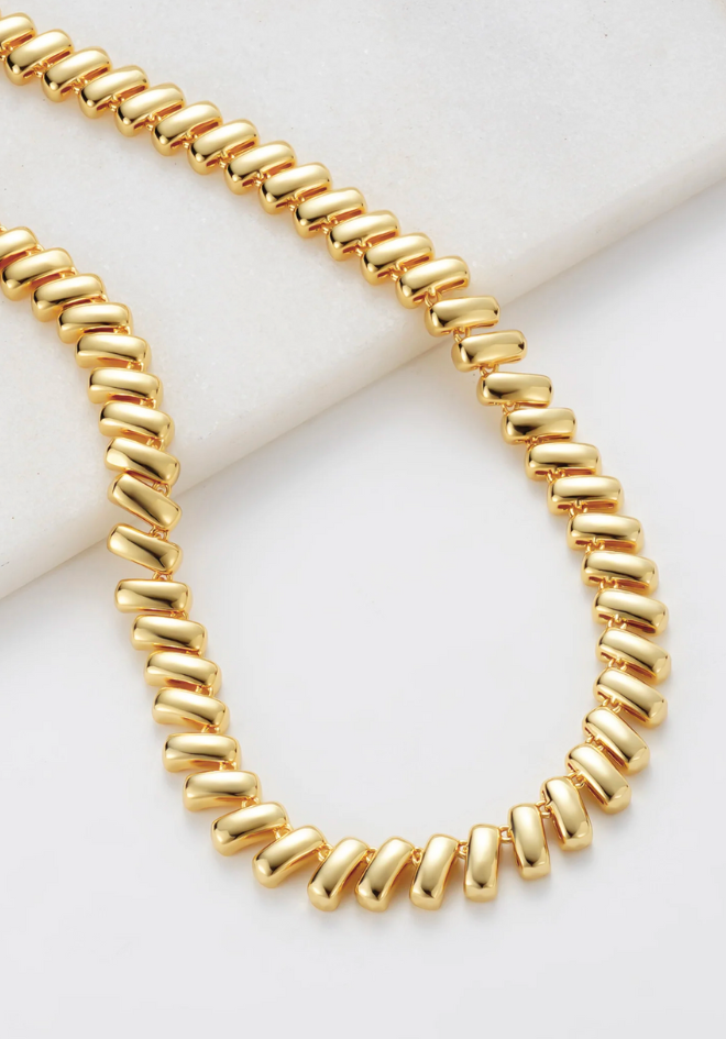 Gold necklace on a white background