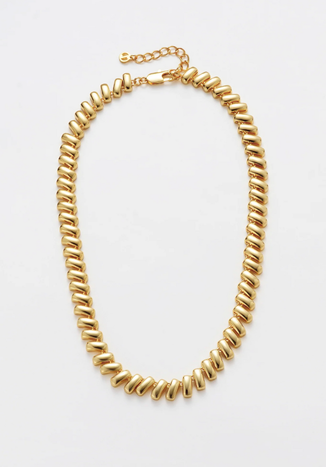 Gold chain necklace on a white background