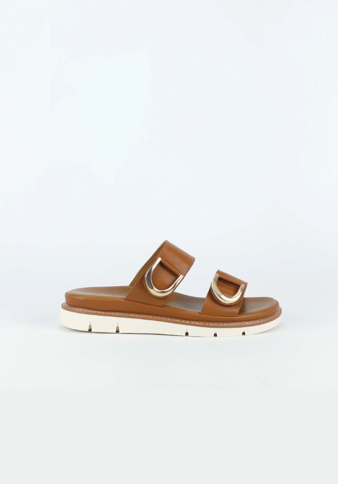 Brown sandal with gold accents on a light gray background