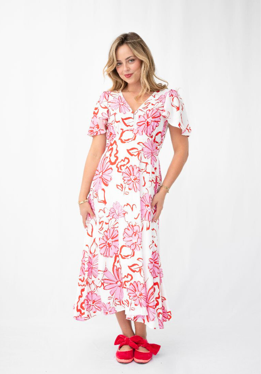 Woman wearing a floral dress on a white background