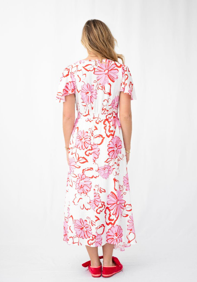 Woman wearing a floral dress on a white background