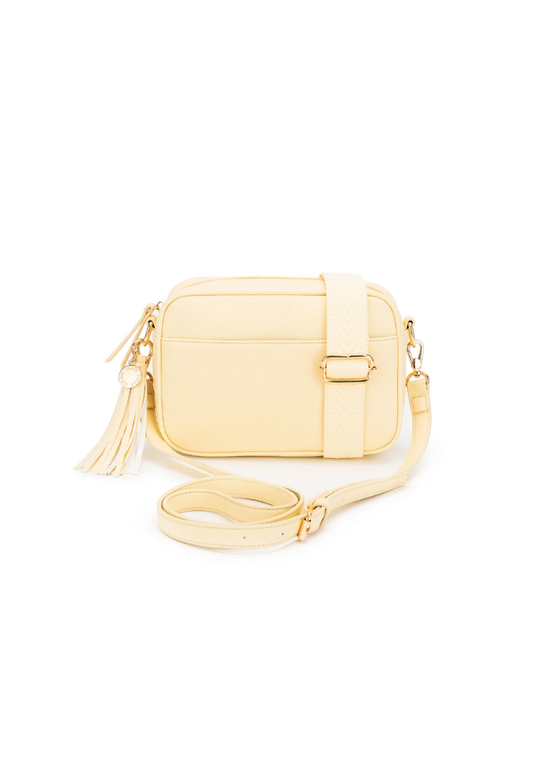 Gold crossbody bag on a white background