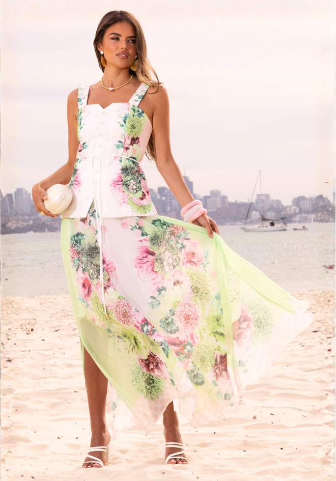 Mia Milani Sorbet Symphony Vest — full-length view of the white floral-print vest styled with flowing pastel floral bottoms, available in Australia at Kat and Ko Clothing