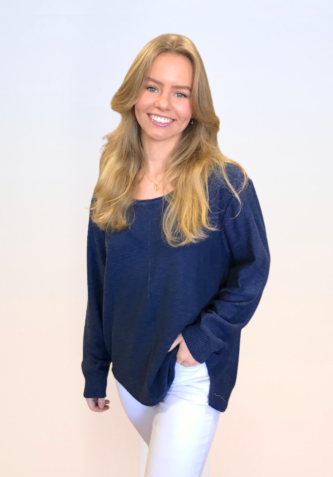 Sacha Top in Navy by Little Lies — front view of navy oversized long sleeve knit top with scoop neckline and relaxed fit, styled with white jeans and gold necklace, available in Australia at Kat and Ko Clothing