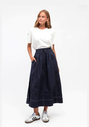 Bella Midi Skirt Navy Label of Love — front view of navy polyester cotton midi skirt with elasticated waistband and white contrast stitch detail