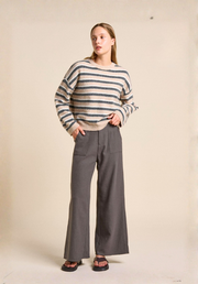 Osaka Pants in Charcoal by Little Lies — wide-leg charcoal linen cotton pants with zip button front closure and elastic back waistband, full length front view