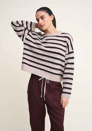Otto Knit Rich Chocolate Stripe by Little Lies — three-quarter editorial shot of cropped cream and chocolate stripe wool blend knit with drawstring hem, styled with deep plum drawstring pants, shop in Australia at Kat and Ko Clothing