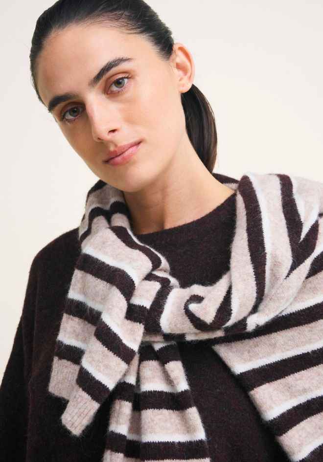 Little Lies Otto Knit in Rich Chocolate Stripe — close-up editorial shot showing soft wool blend stripe knit texture draped over shoulder, cream and chocolate colourway, available in Australia at Kat and Ko Clothing