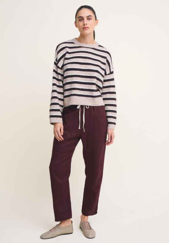 Otto Knit Rich Chocolate Stripe Little Lies — full length front view of cropped cream and chocolate stripe wool blend knit with ribbed cuffs and drawstring hem, styled with deep plum drawstring pants and grey sneakers, shop in Australia at Kat and Ko Clothing