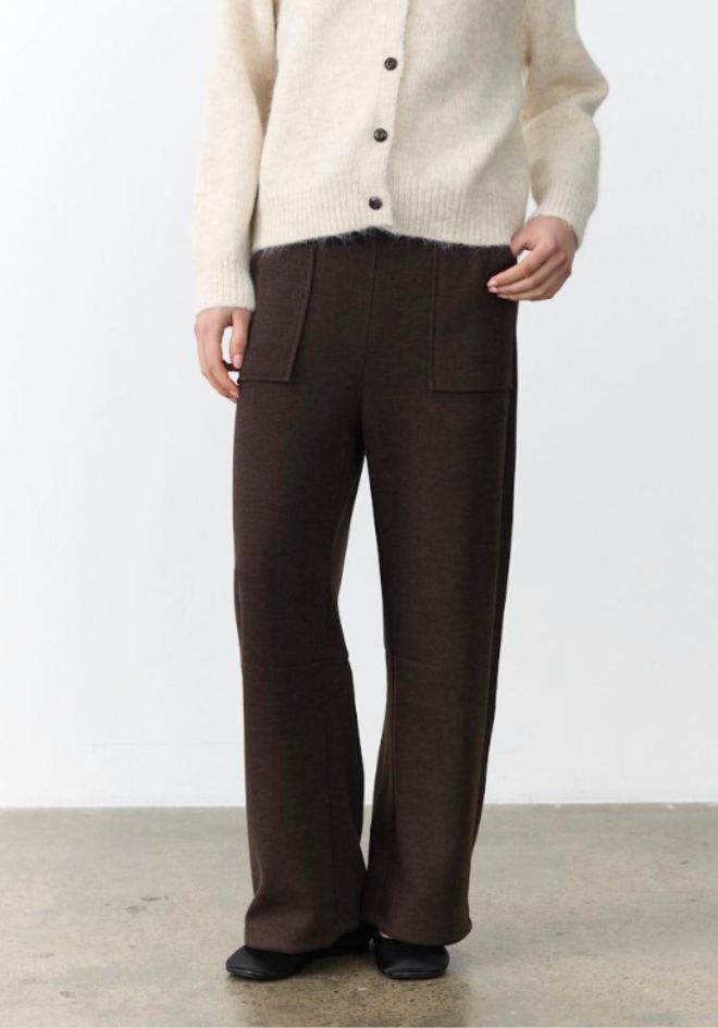 Lenni Barrel Leg Pants in Chocolate by Little Lies — cropped front view of dark chocolate brown wool blend barrel leg pants with patch pockets and drawstring waist, styled with cream fluffy button cardigan, shop in Australia at Kat and Ko Clothing